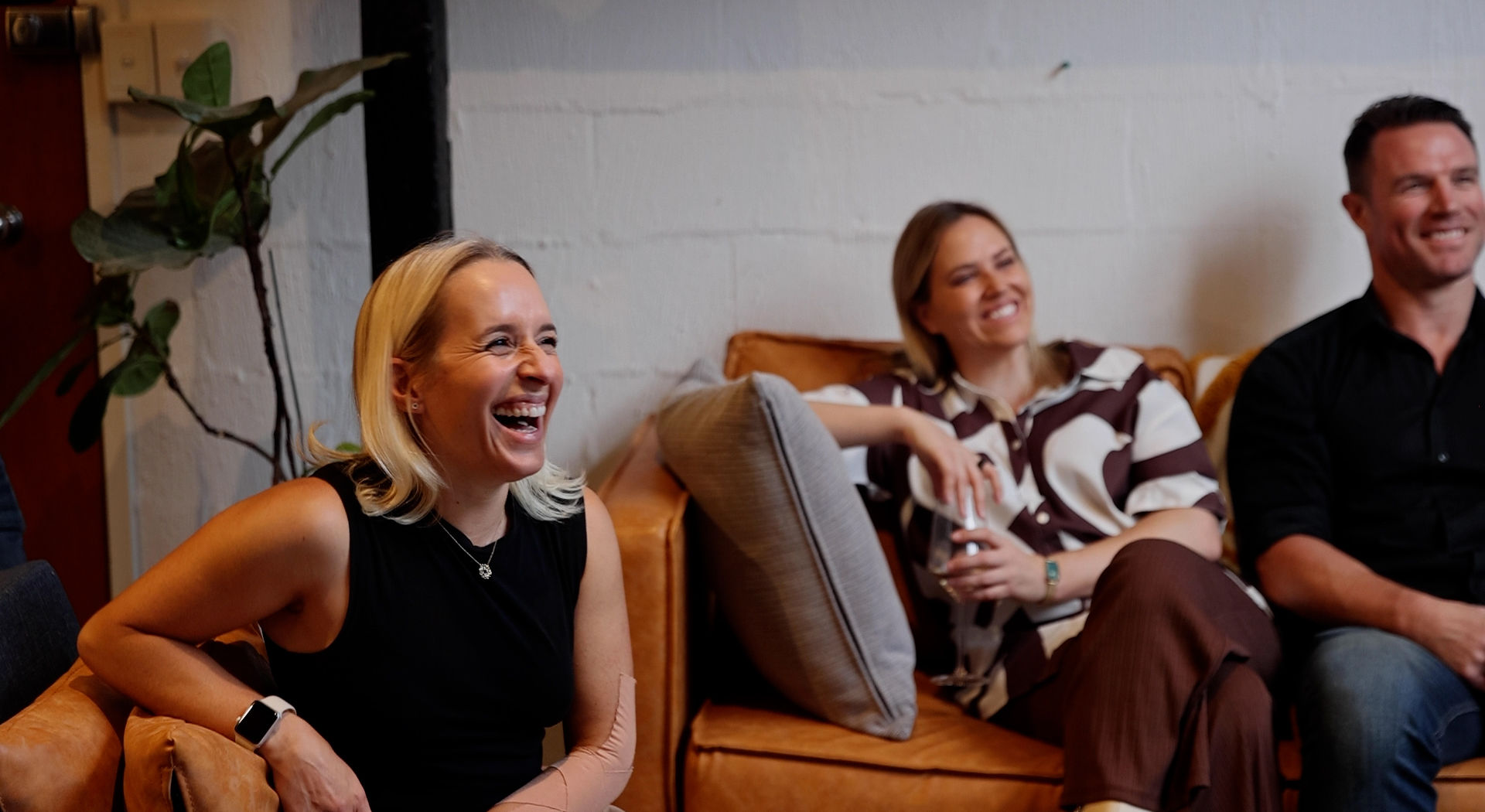 Jodie Coall laughing with guests at her book launch